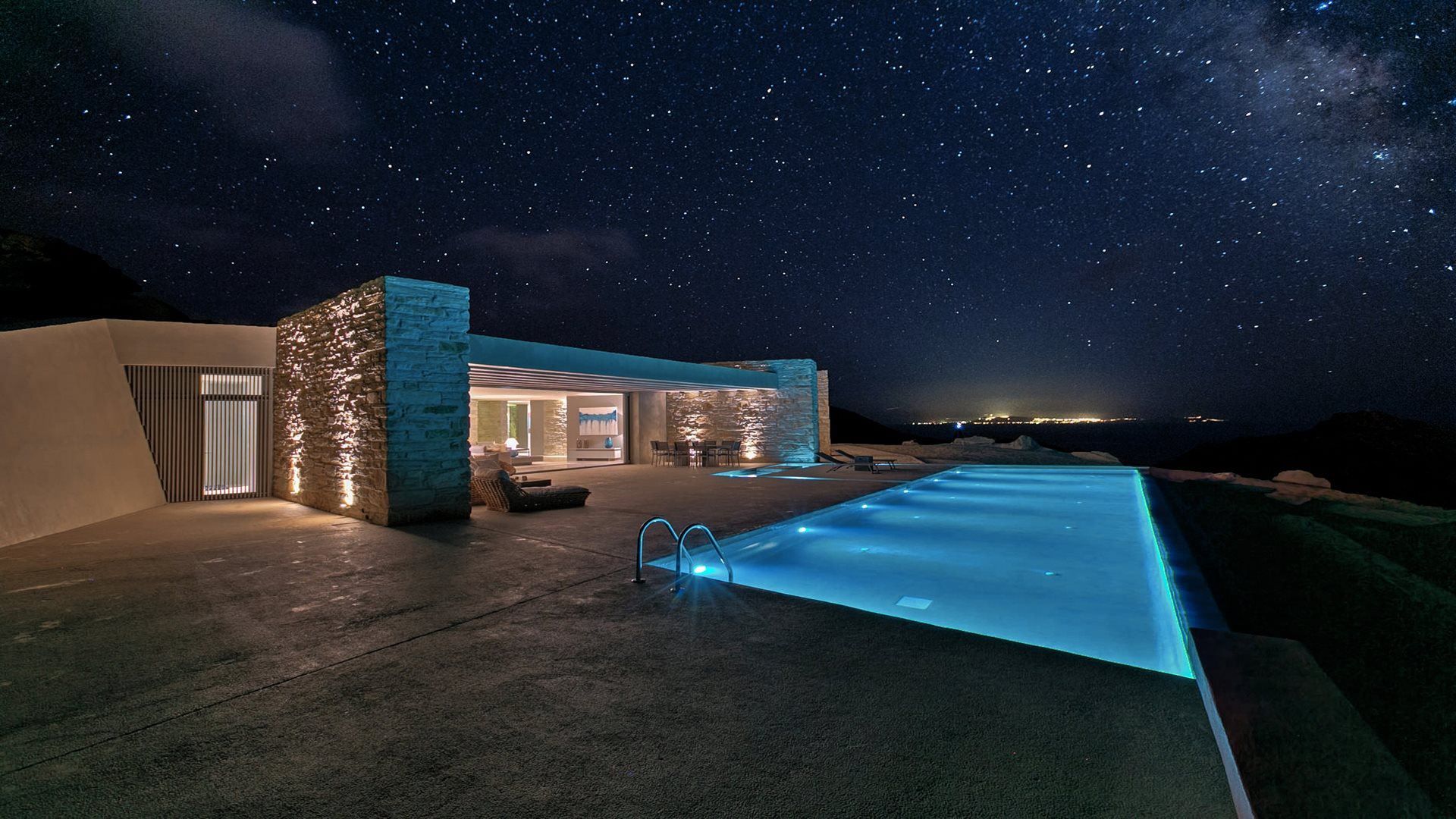 Villa Mylo and its infinity pool under a starry sky